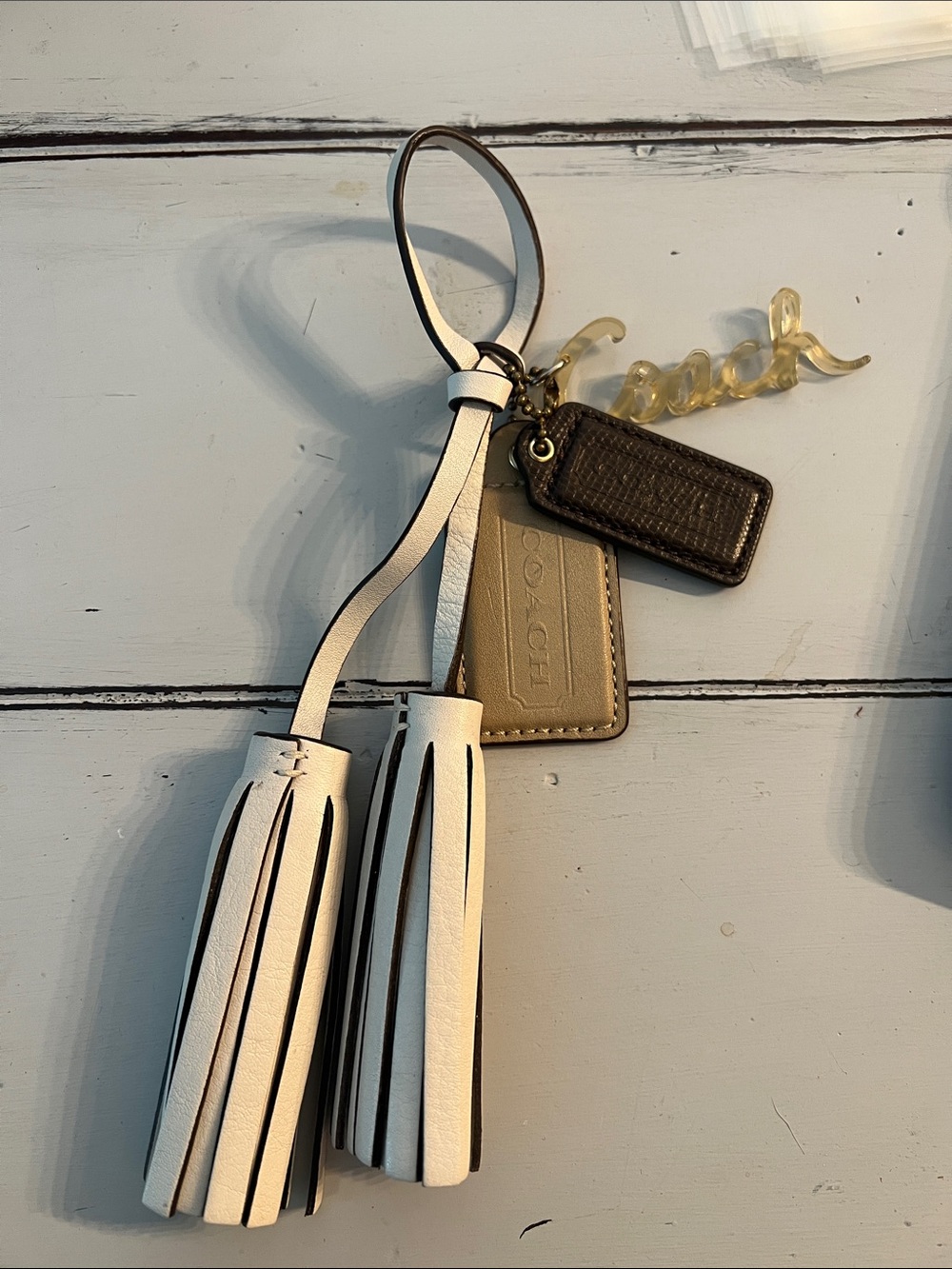 Coach White Tassel Keychain with Gold Script Charm